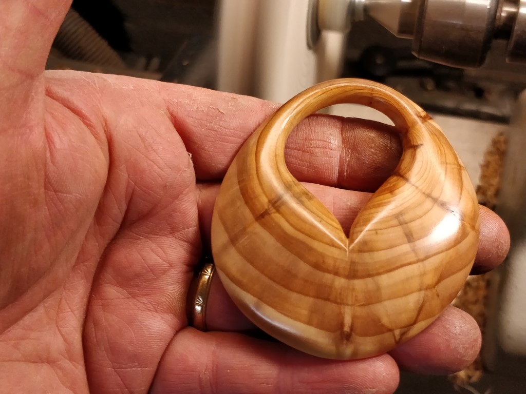 Pendant, heart shape, carved out of yew