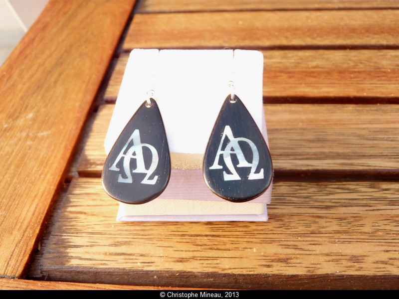 Alpha and Omega, earings made of ebony inlaid with white mother of pearl.