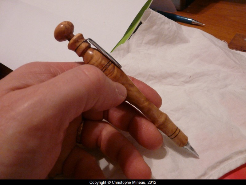 Little mechanical pencil of olive wood.
