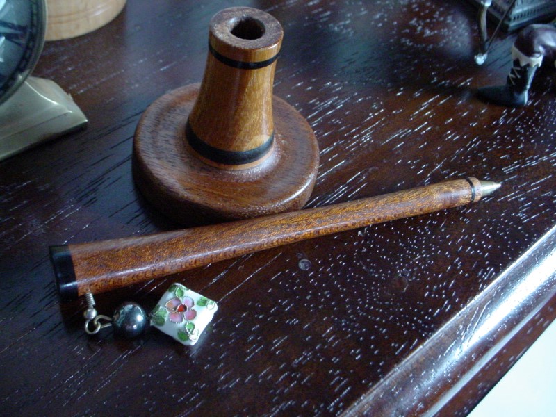 Bic pen. Mahogany, ebony, mother of pearl, and an orphaned earring.