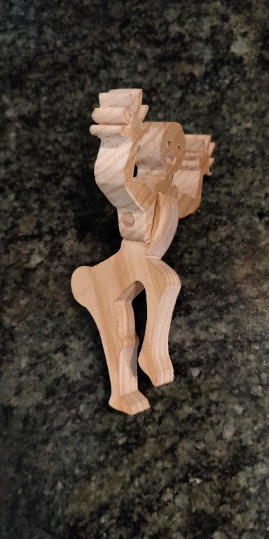 A small scroll sawn man to avoid pasta boil over