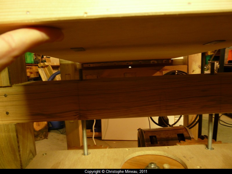 The tilting table is mounted using a piano long hinge.
