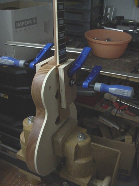 Gluing the neck with the body.