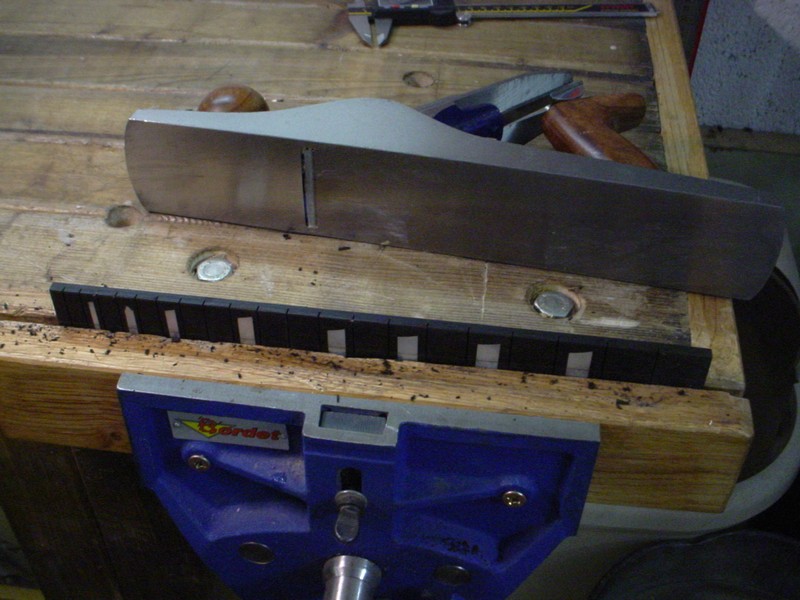 Once inlays installed, the sides are cut and planed straight.