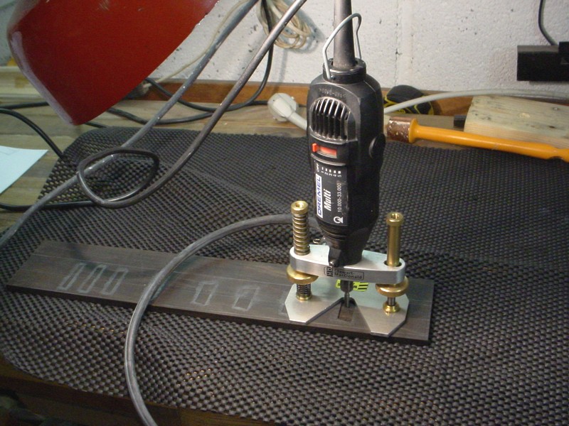 I use the classic Dremel mount from Stewmac.