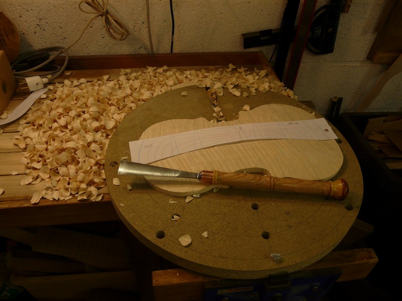 Starting the carving, with the two handed gouge.