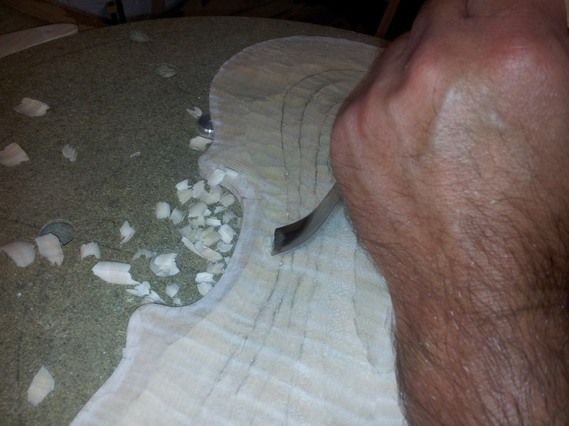 Using the spoon gouge in the C bouts.