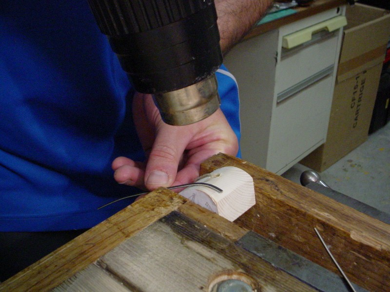 Re-use of the counter corner blocks to shape the purfling with hot air.