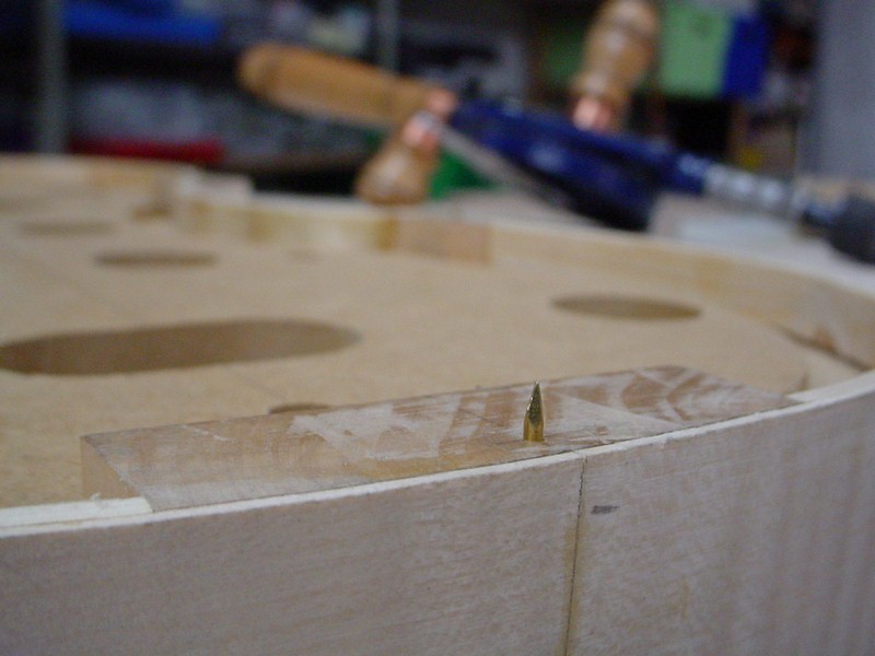 It is first used with the point upward, it allows to mark the back where the holes will have to be drilled.