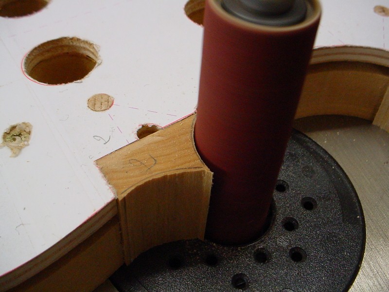 Shaping the corner blocks with the oscillating spindle sander.