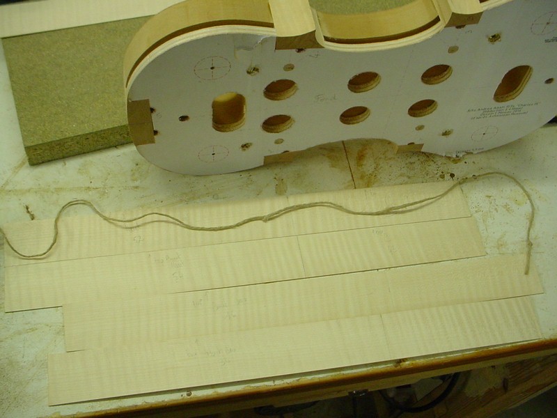 Laying out the sections on the sides. A string is used to roughly measure on the mould.