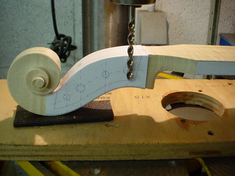 For carving the pegbow, I start by drilling some holes to remove most of the wood.