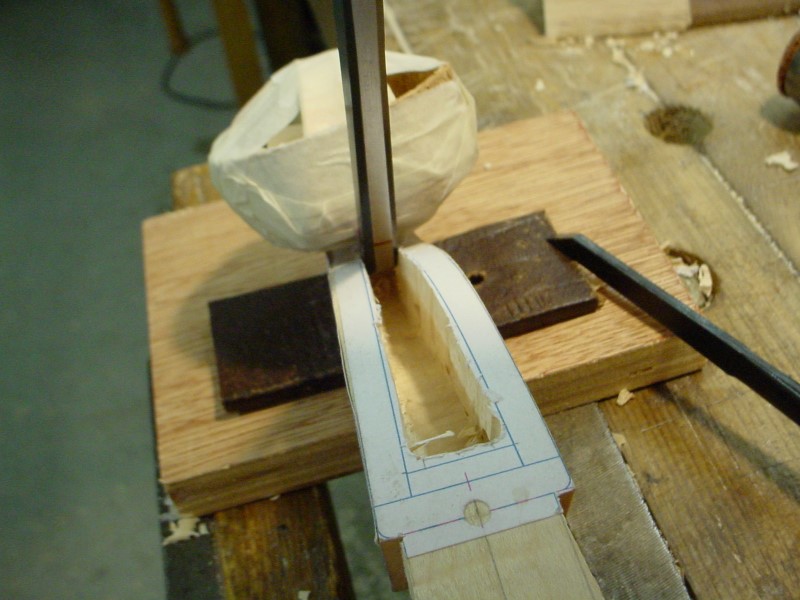 The desired depth is marked on the chisel with a sharpie.