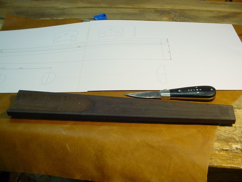Moving to the fingerboard. Tracing the edges on the pre-shaped purchased blank.