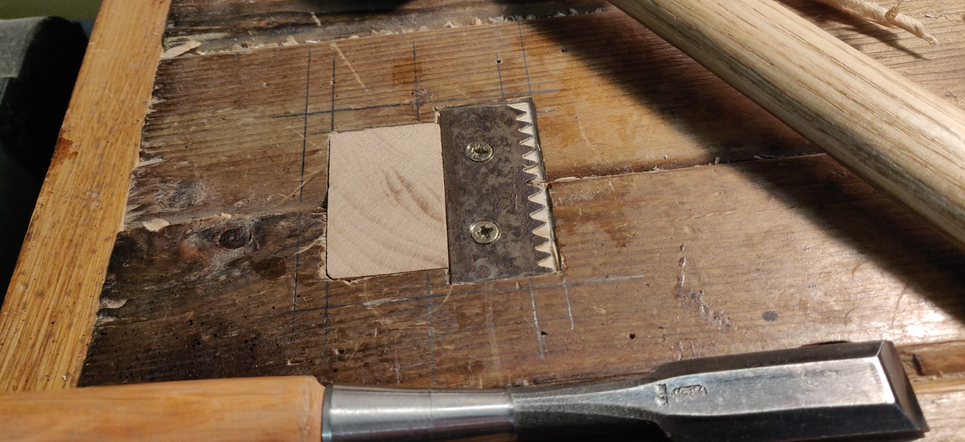 The stop retracted under the surface of the workbench.