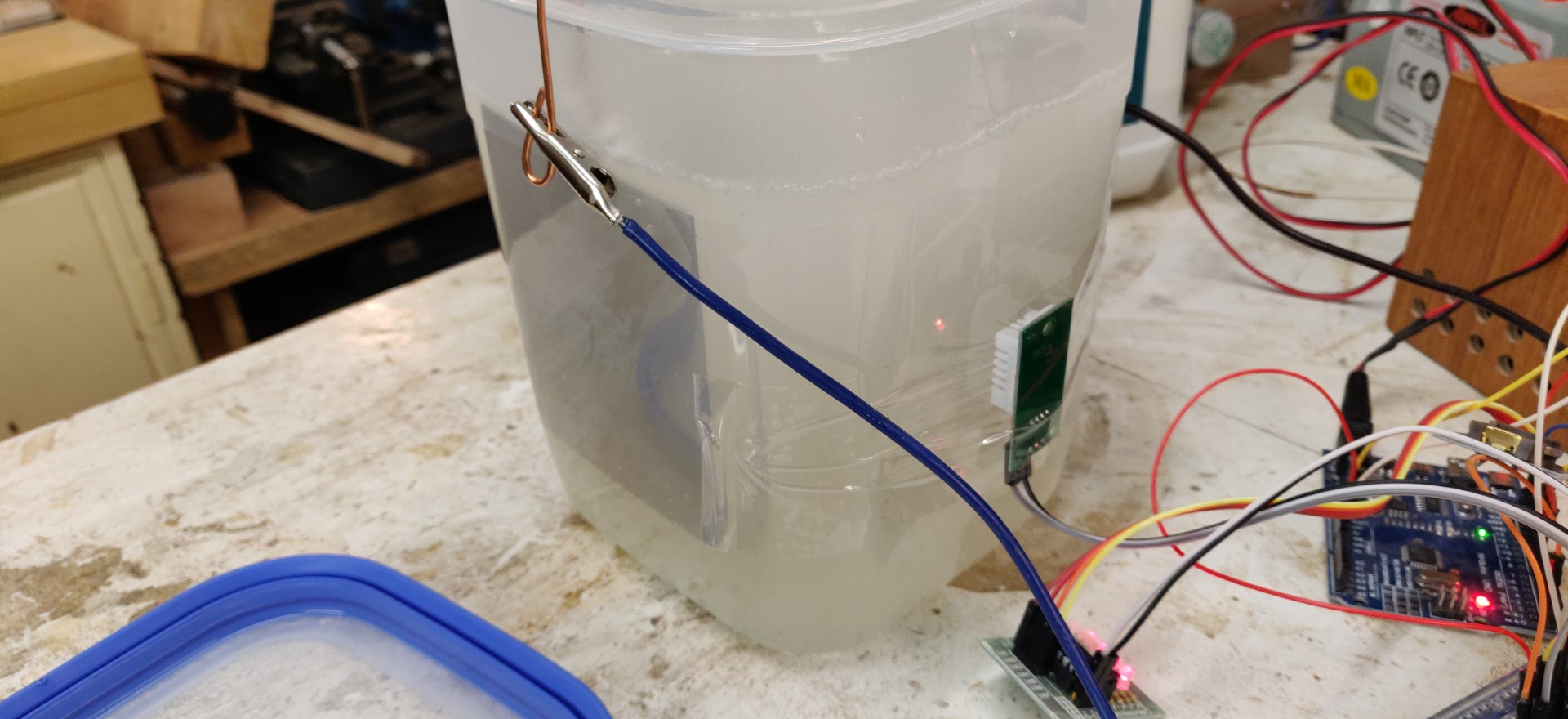 The nickel electrodes are soldered to a copper wire and placed on either side of the tank. 